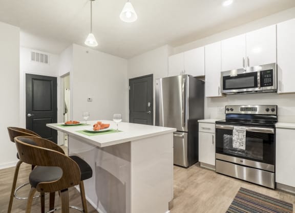 1 bedroom apartment with white cabinets and stainless steel appliances near UNMC in Omaha's Blackstone District