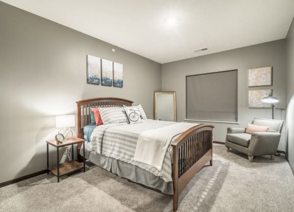 1-bedroom apartment with king-size bed and walk-in closet at The Conrad in Blackstone District Omaha