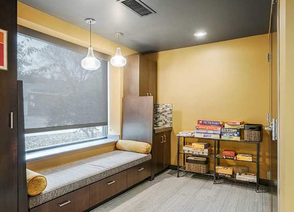 a pub room with built-in lounge/bench seating with board games