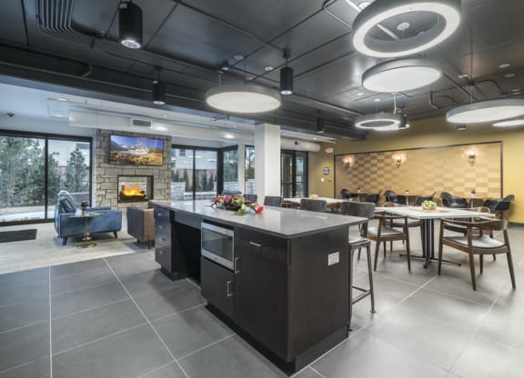 The Conrad clubhouse with kitchen and fireside seating-Blackstone District Omaha NE