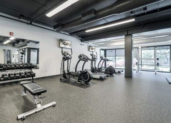 Fitness center with cardio and free weights at The Conrad near UNMC in the Blackstone District Omaha NE 68105