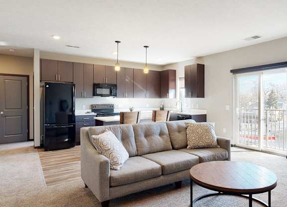 Furnished apartment living area with sofa and coffee table