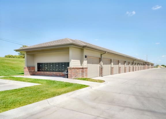 Row of garages and mailboxes on one end outside the Flats at Shadow Creek