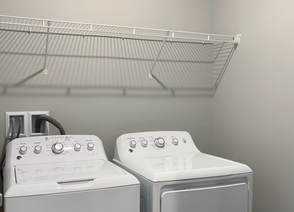 Washer and dryer closet with shelving space The Flats at Shadow Creek in Lincoln Nebraska