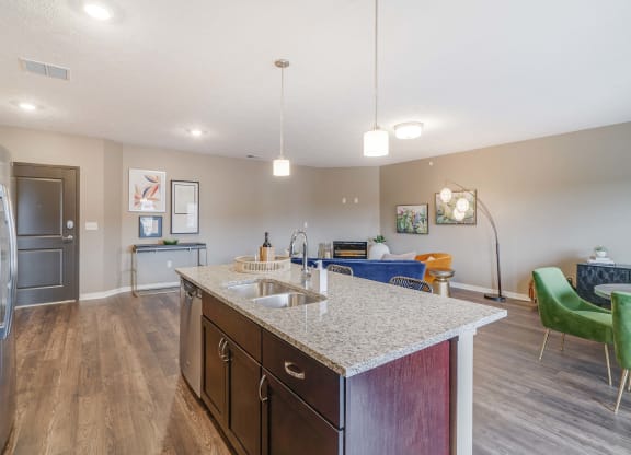 View of kitchen island and living room at The Flats at Shadow Creek