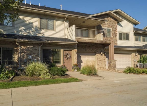 Townhomes with attached garages and large balconies  at Grand Legacy apartments and townhomes in west Omaha NE 68130