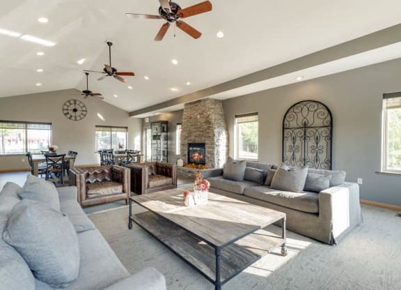 Clubhouse with social spaces and comfortable couches at Grand Legacy apartments and townhomes in west Omaha NE 68130