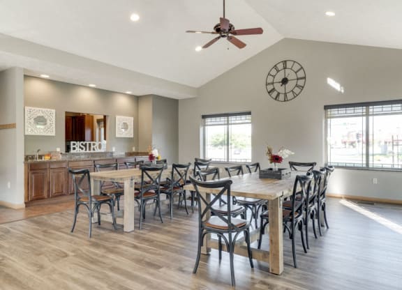 a clubhouse room with long tables and chairs for hosting events
