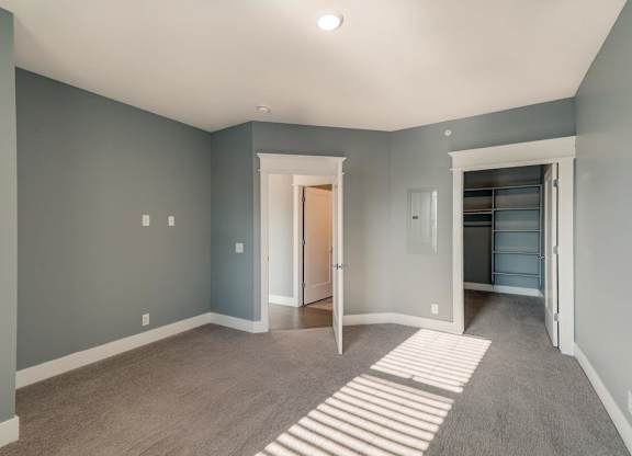 A room with a striped rug on the floor.