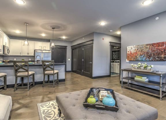Complete view of furnished living room and kitchen spaces at The Helen