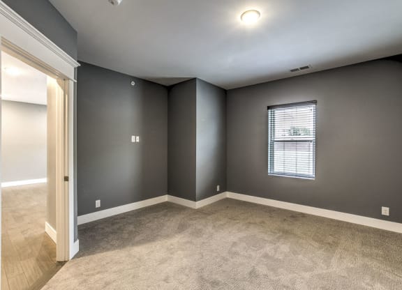 Large bedroom with natural light at The Helen