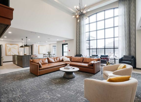 The clubhouse lounge featuring a floor to ceiling window and plenty of seating options