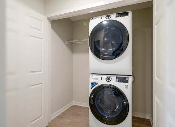 A stackable front-loading washer and dryer with additional storage space