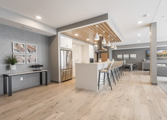 View of gourmet kitchen and seating in our amenity space
