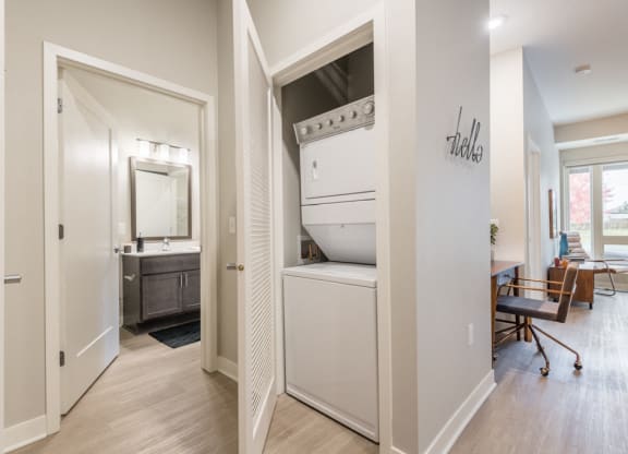 Interiors- View of bathroom, laundry and living room at The Preserve at Normandale Lake in Bloomington, MN