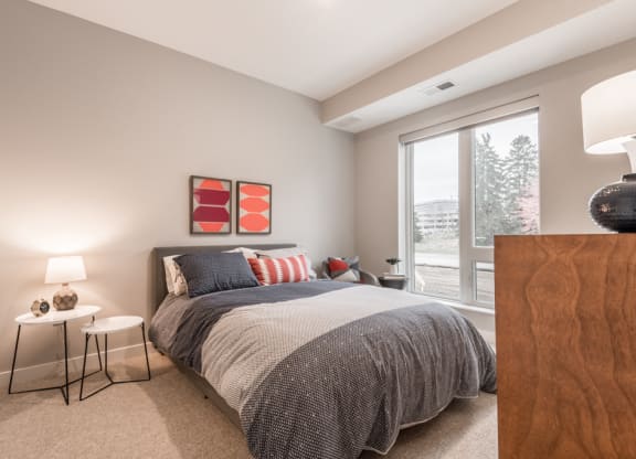 Interiors- Large bedroom with natural light at The Preserve at Normandale Lake in Bloomington, MN