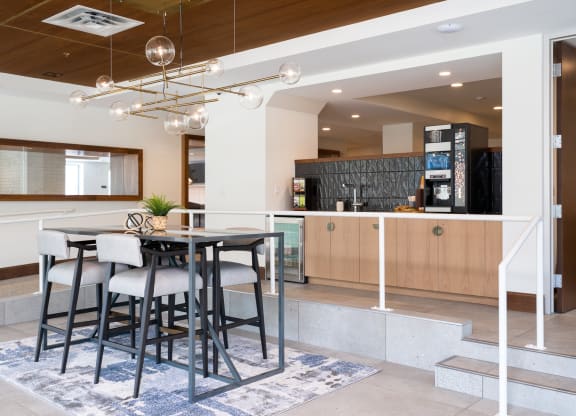 Coffee bar on back counter space with table and seating