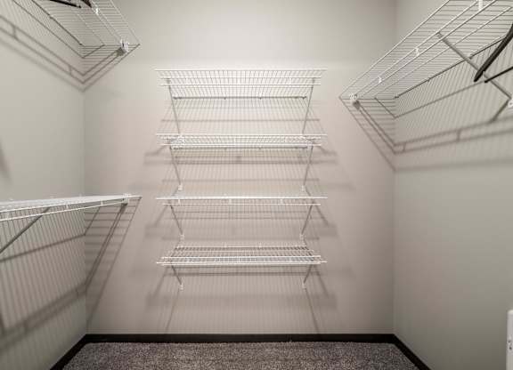 Empty shelves in a white room.