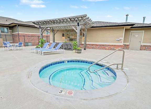 A round above ground pool with a metal railing around it.