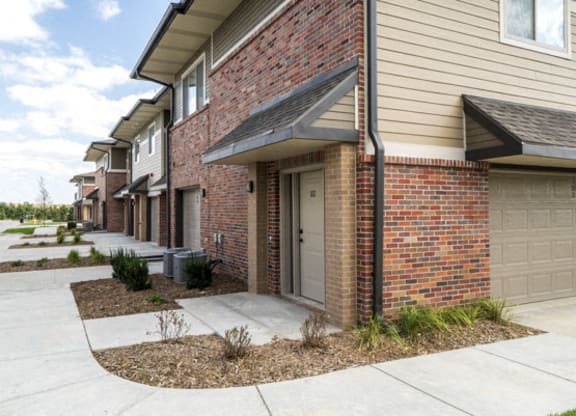 Exterior view of private entrances and garages at The Villas at Falling Waters in west Omaha NE