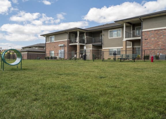 Private dog park with agility equipment at The Villas at Falling Waters townhomes in west Omaha NE