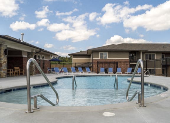 Resort-style pool with shallow soaking area at The Villas at Falling Waters townhomes for rent in west Omaha NE