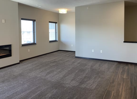carpeted living room and nook area