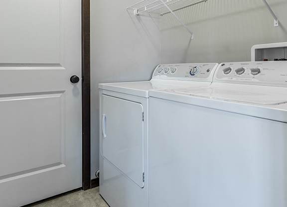 white washer and dryer in laundry room