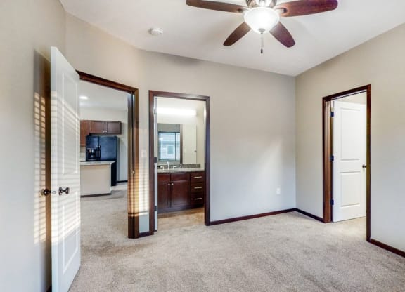 Spacious master bedroom in the Ash at The Villas at Wilderness Ridge luxury apartments in southwest Lincoln NE 68512