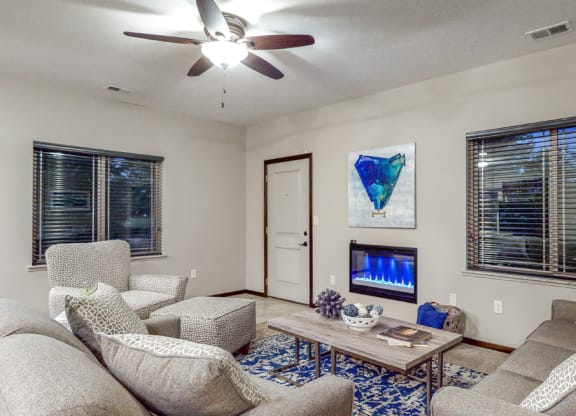 The spacious living area of the Cedar features an electric fireplace