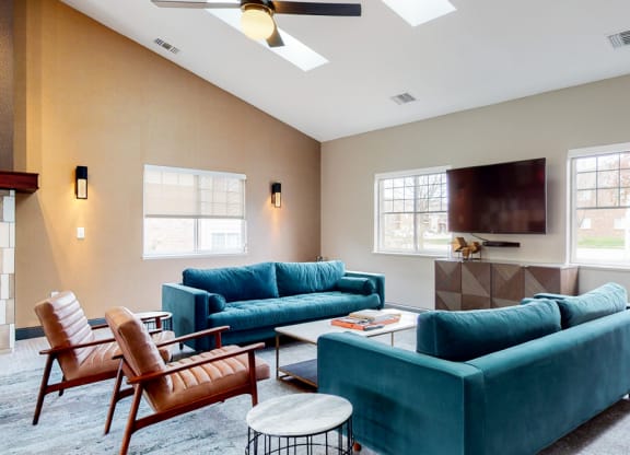 Casual sitting area with TV at the community clubhouse at The Northbrook Apartments