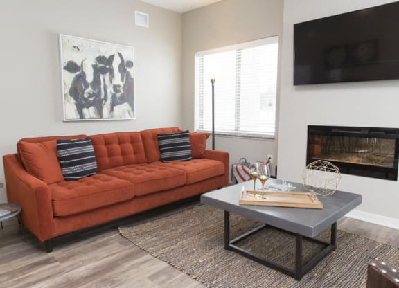 Living room space with fireplace at The Villas at Mahoney Park