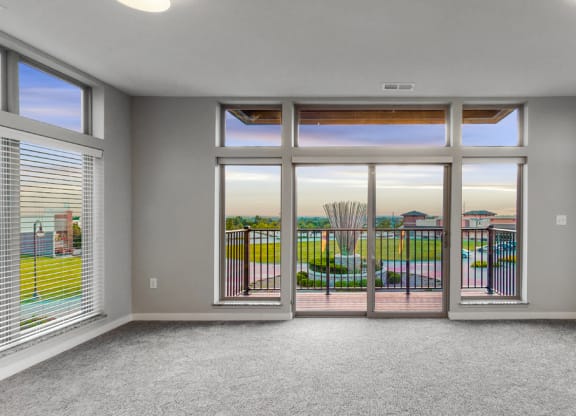 Large living area with floor to ceiling windows providing lots of natural light at WH Flats