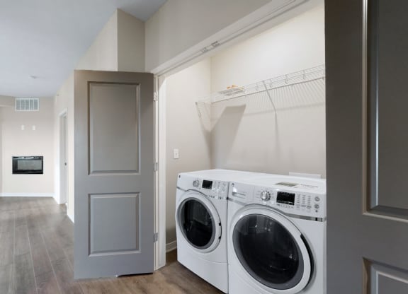 A washer and dryer are included in the 2 bedroom Marigold with den floor plan at WH Flats