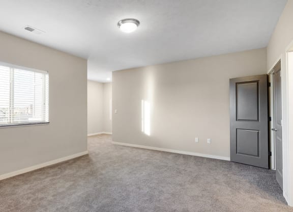 The large bedroom with den area in the Marigold with den floor plan is perfect for a desk or reading nook.