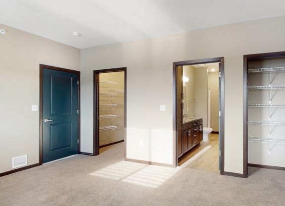 You'll love the large walk-in closet in the master bedroom of the Snowdrop with den floor plan at WH Flats.
