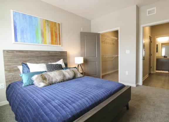 Bedroom with walk-in closet at WH Flats new luxury apartments in south Lincoln NE 68516