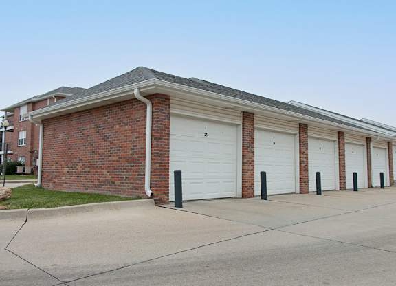 A long building with a row of garage doors