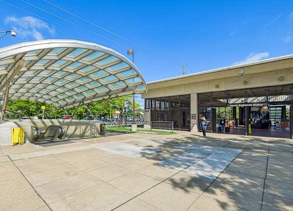 A modern building with a curved roof and a glass facade.