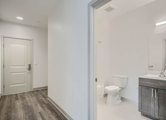 A bathroom with a toilet and sink.