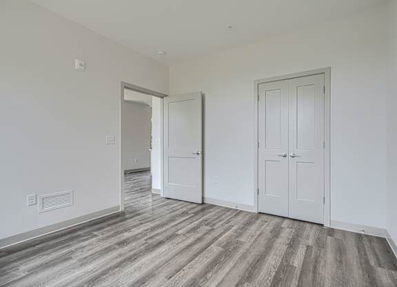 A room with a grey floor and white walls.