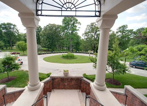 A view of a courtyard from a second floor balcony.