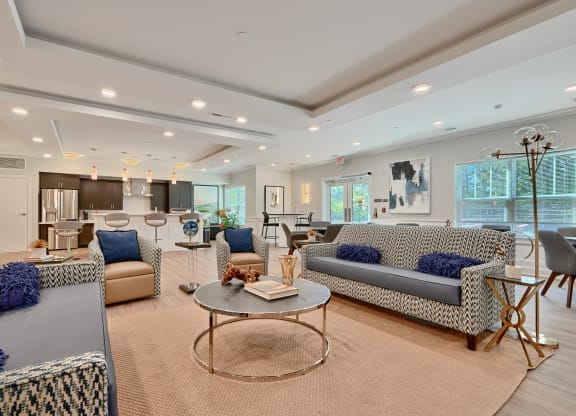 a living room with couches and chairs and a table