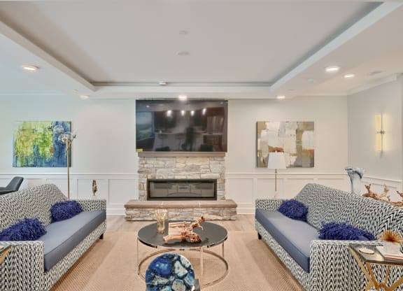 a living room with couches and a fireplace