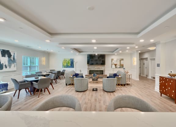 a dining room with tables and chairs in a large room