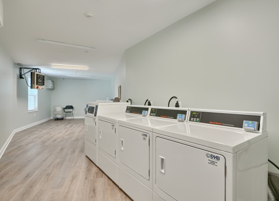 the preserve at ballantyne commons laundry room with washes and dryers
