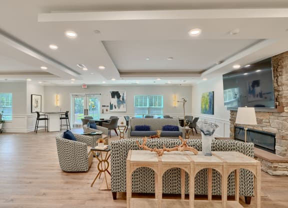 a living room with couches and chairs and a table