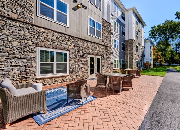 our apartments offer a spacious courtyard with tables and chairs