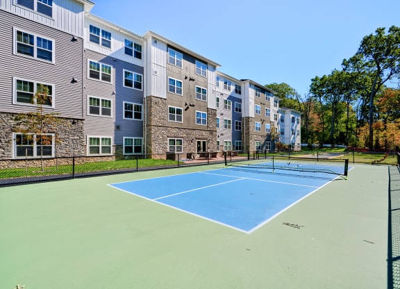 the court at the preserve at polk apartments with tennis courts