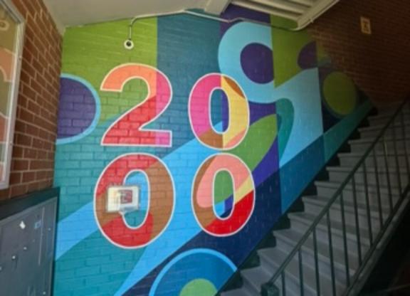A staircase with a 2000 painted on the wall.